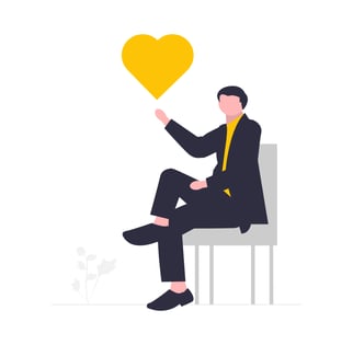 UnDraw illustration of a man sitting in a chair holding a yellow heart
